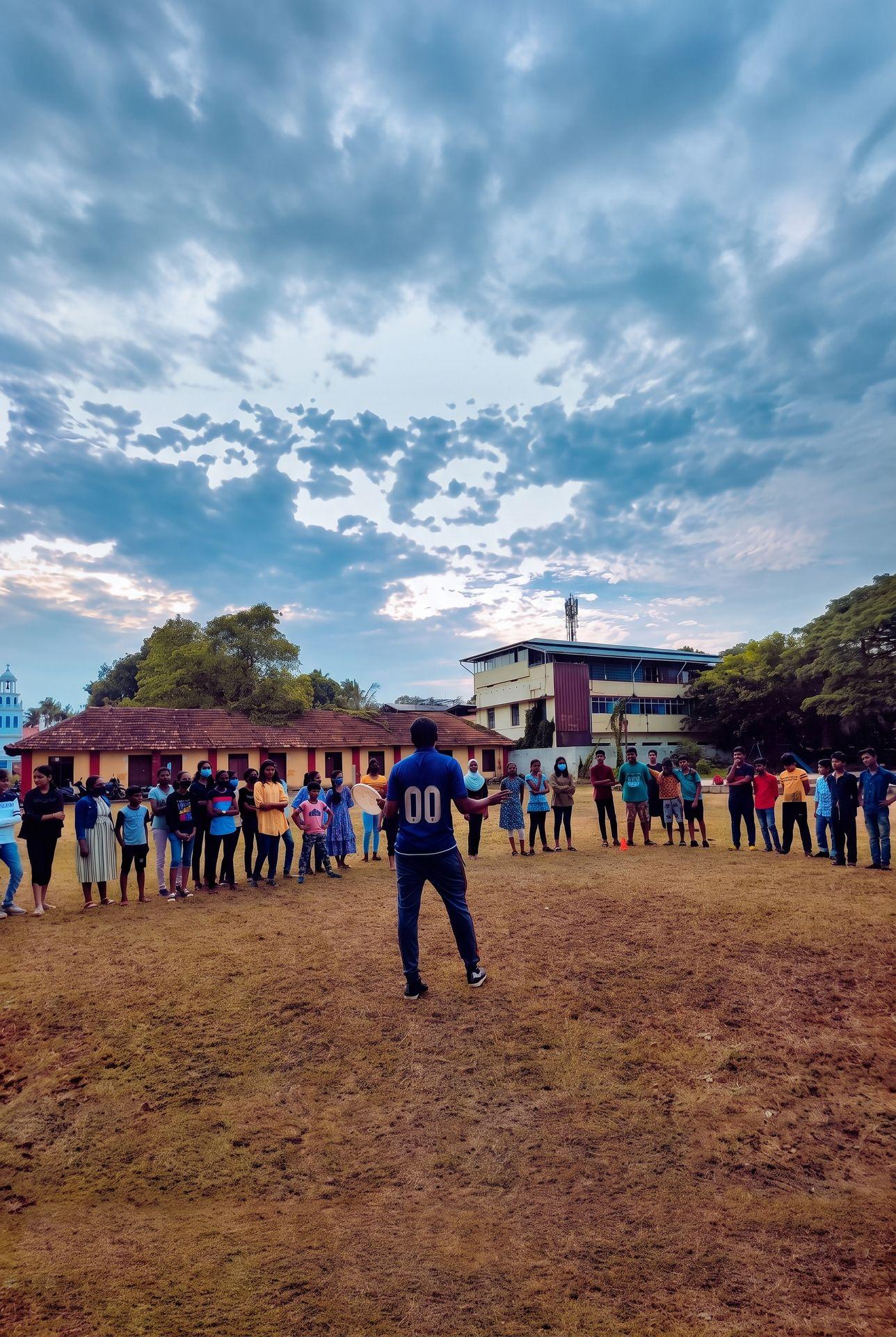 A coach leading a session with a group of children