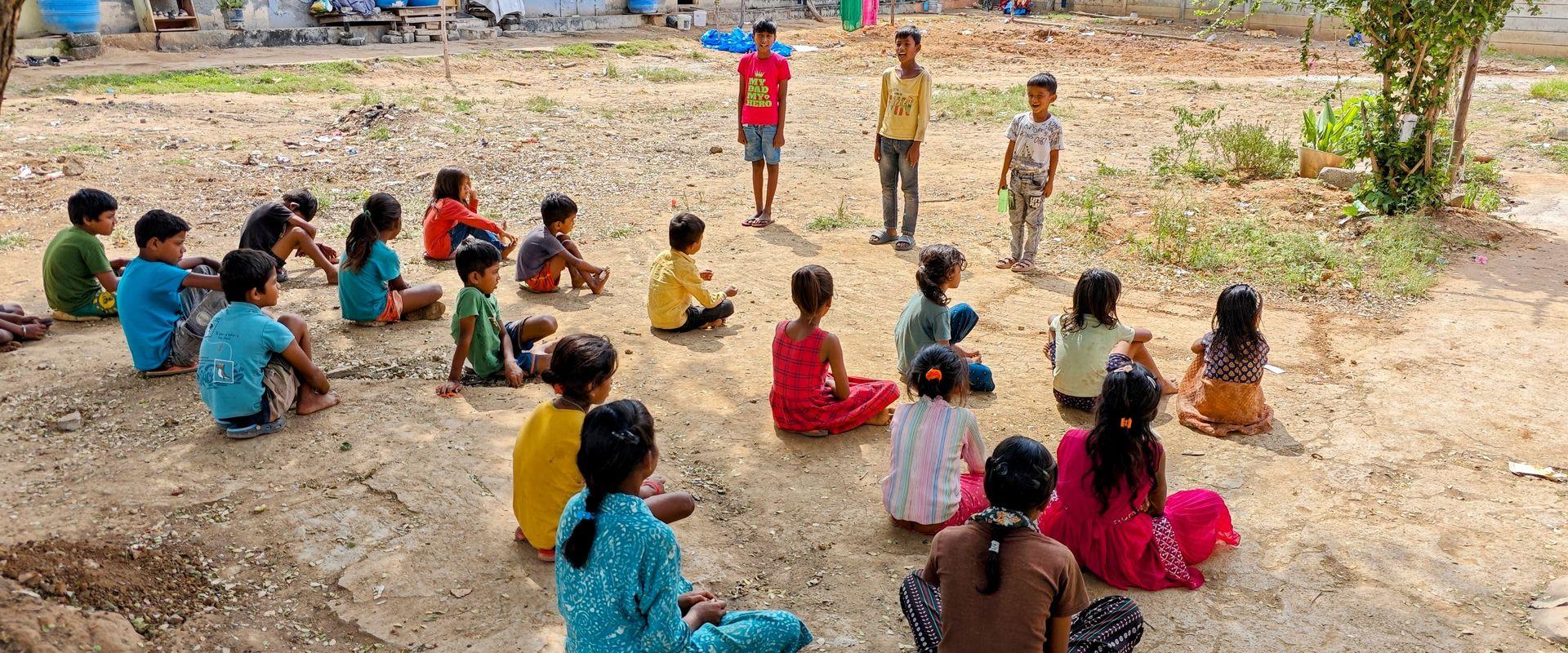 A child leading the group through a warm-up exercise